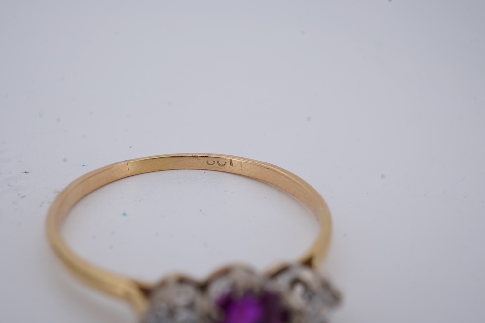 A yellow metal, stamped 18ct, ruby and diamond set three stone ring, size W, together with a yellow metal ruby and diamond set full eternity ring, size Q, gross weight 4.4 grams. Condition - poor to fair